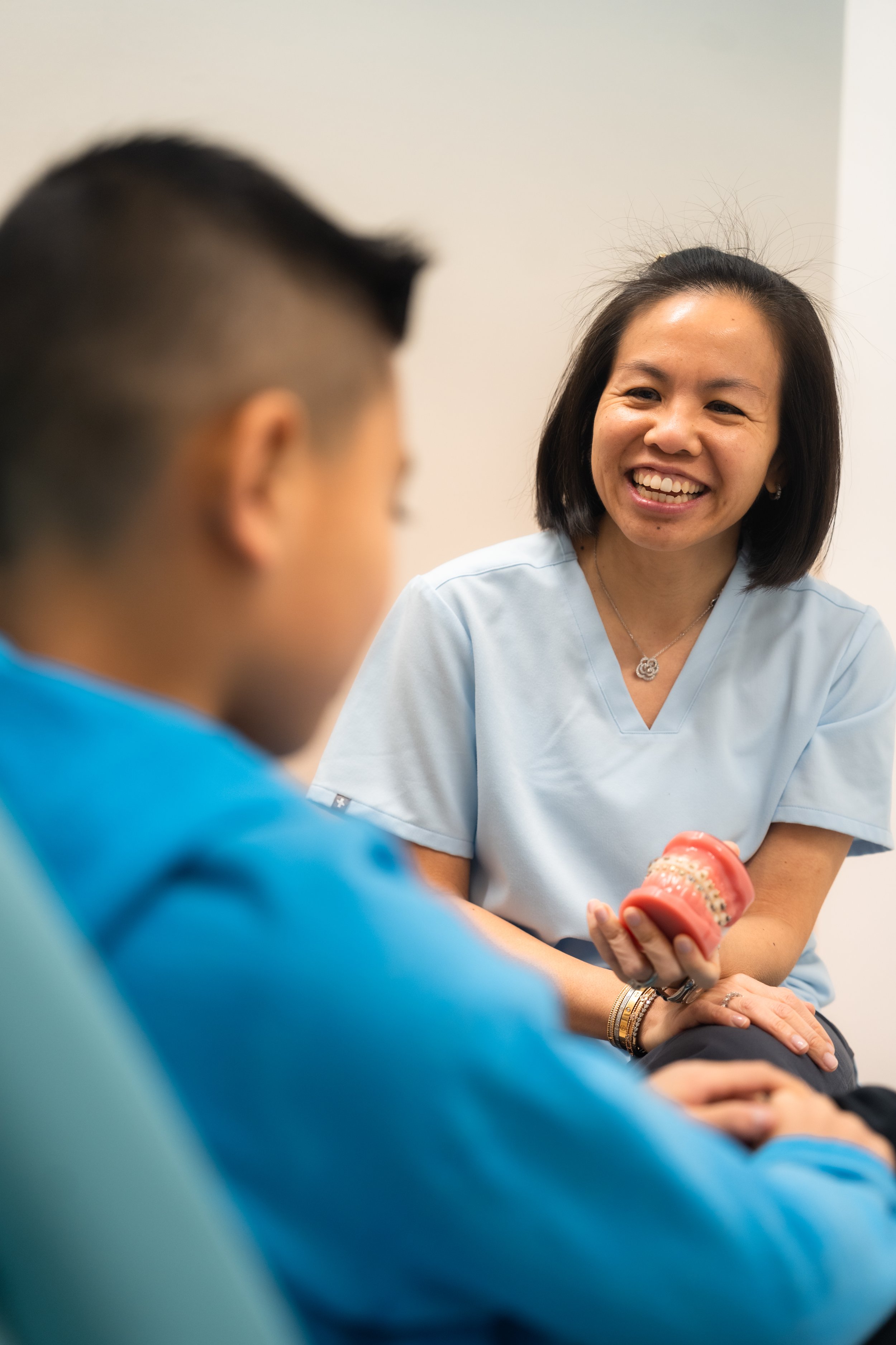 Dr. Shauna Fung greeting a young patient