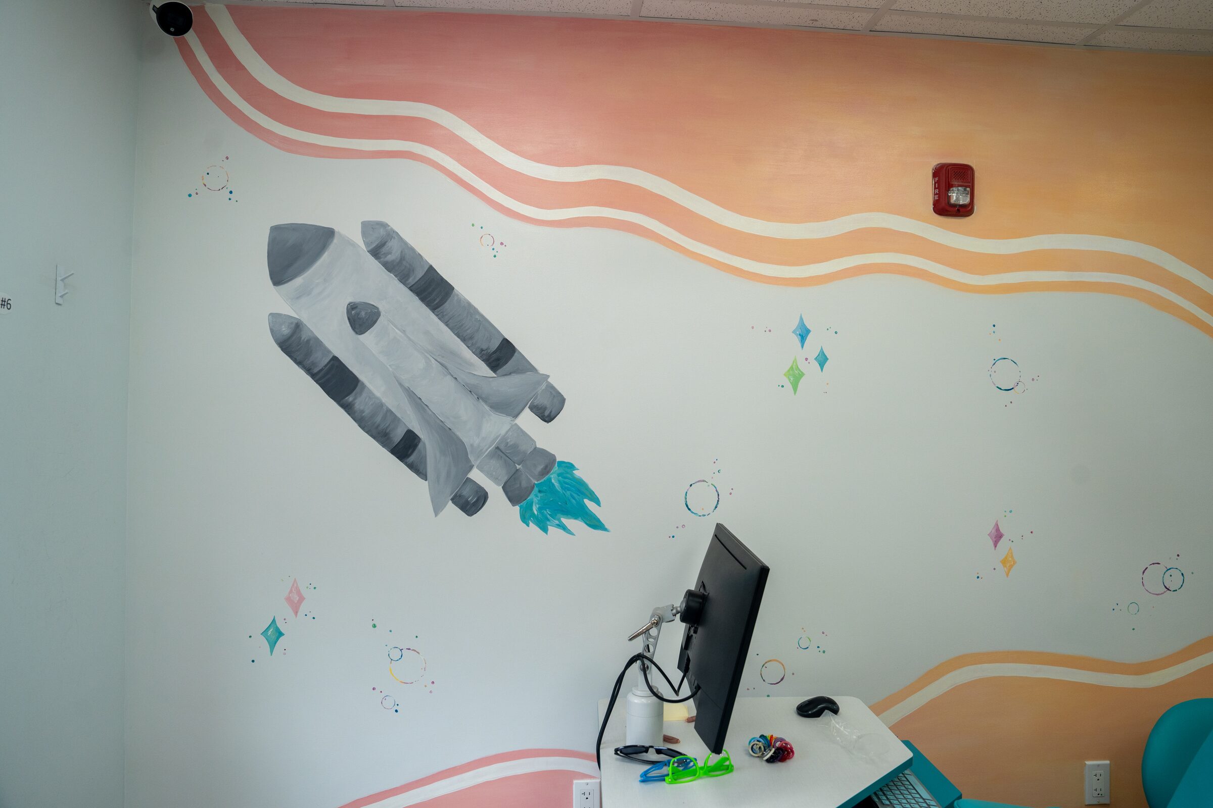 The rocket mural above a consultation monitor