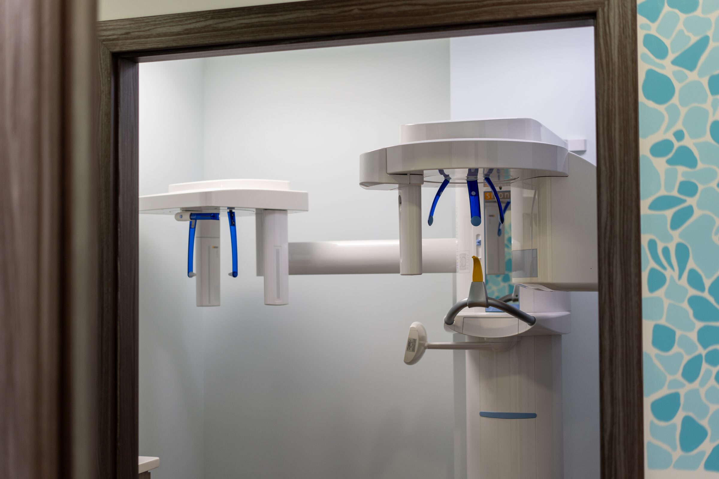 The panoramic X-ray machine, seen through the doorway of the imaging room