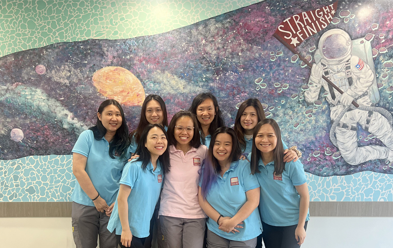 The Straight Finish Orthodontics team together at the Brooklyn office